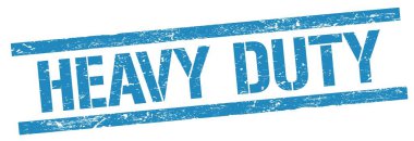 Mavi grungy dikdörtgen damga işareti üzerinde HEAVY görev metni.