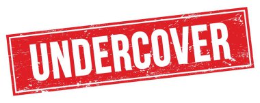 Kırmızı grungy dikdörtgen mühür işareti üzerinde UndERCVER metin.