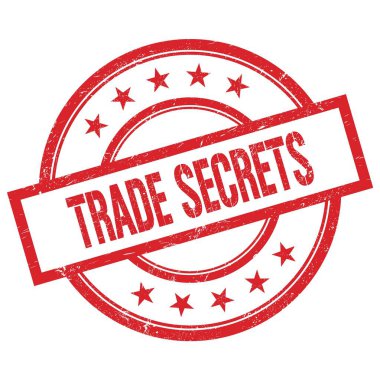 TRAD GİZLERİ Kırmızı, yuvarlak, lastik damga üzerine yazılmış metin.