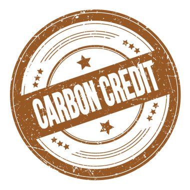 Kahverengi yuvarlak dokuma damgası üzerine CARBON CREDIT metni.