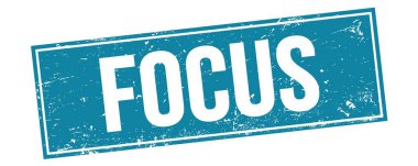 Mavi grungy dikdörtgen damga işareti üzerine FOCUS metni.