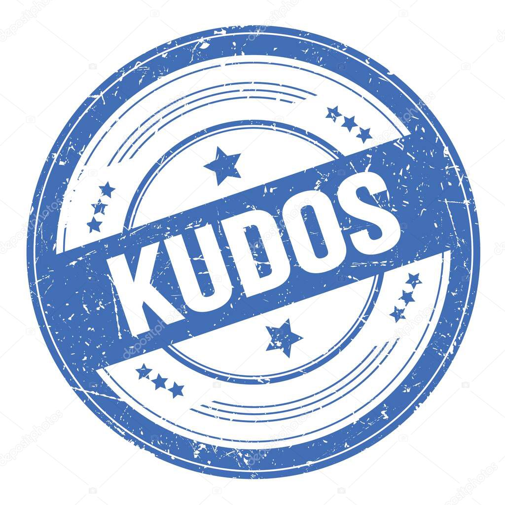 KUDOS text on blue round grungy texture stamp.