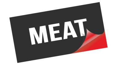 Siyah kırmızı etiket damgası üzerine yazılmış MEAT metni.