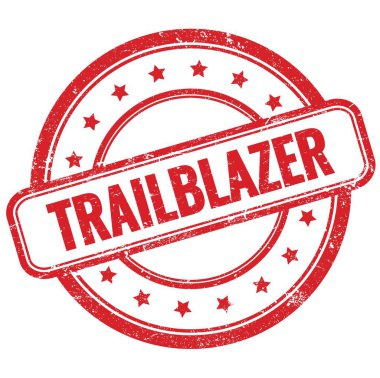 Kırmızı, eski, pasaklı, yuvarlak, lastik damgalı TRAILBLAZER metni.