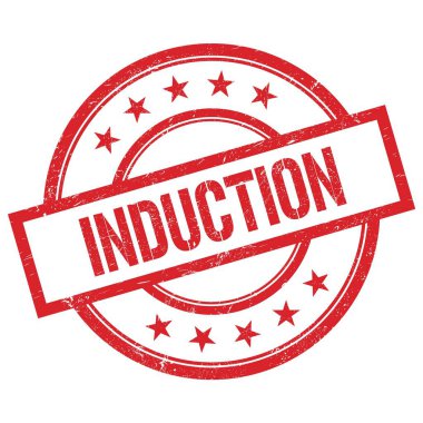 Kırmızı yuvarlak plastik damga üzerine yazılmış INDUCTION metni.