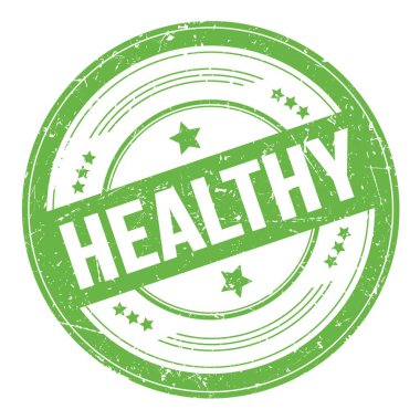 Yeşil yuvarlak grungy doku damgası üzerine sağIıklı metin.