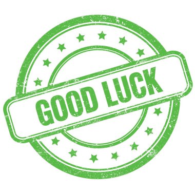 Yeşil, eski, pasaklı, yuvarlak lastik damgalı iyi şanslar metni..