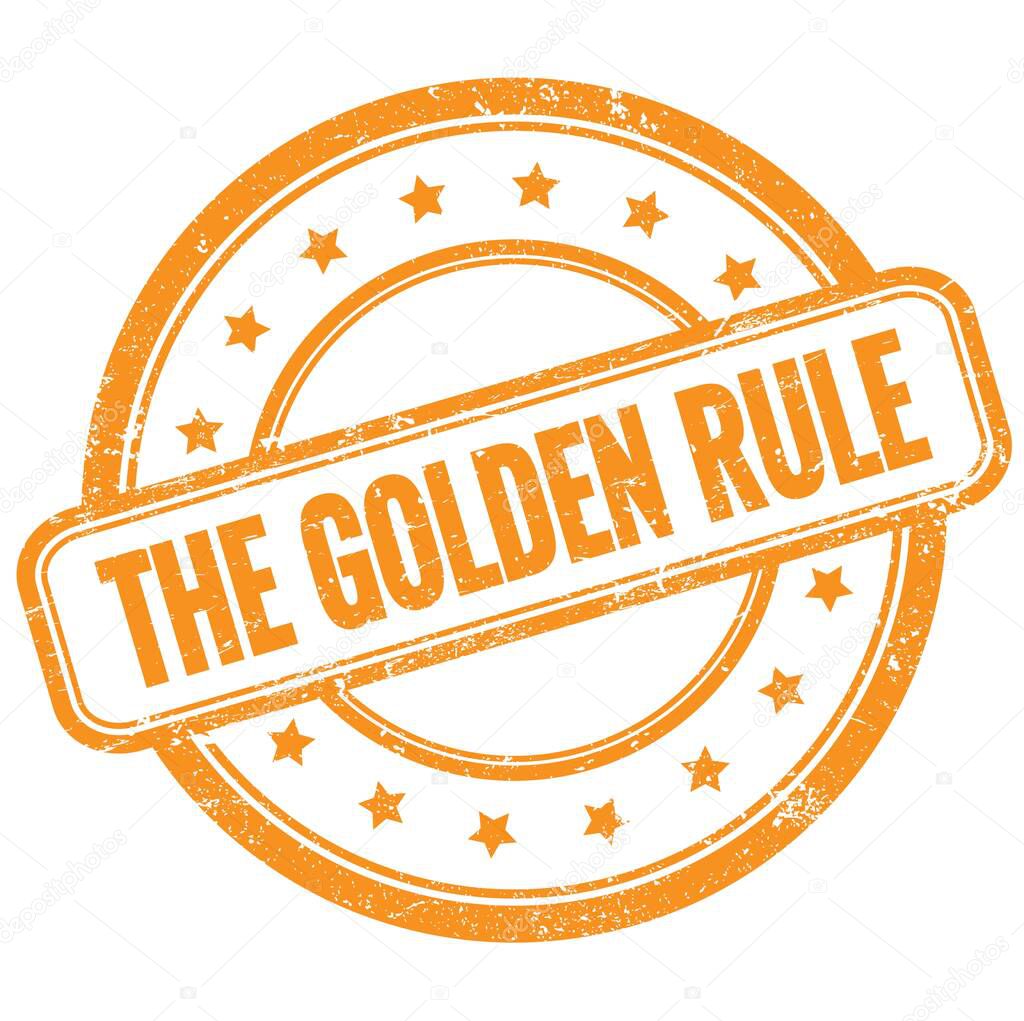 THE GOLDEN RULE text on orange vintage grungy round rubber stamp.