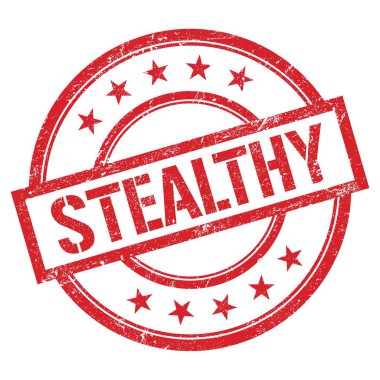 Kırmızı yuvarlak plastik damga üzerine yazılmış STEALTHY metin.
