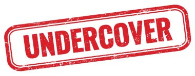 Kırmızı grungy dikdörtgen damgalı Undercover metni.