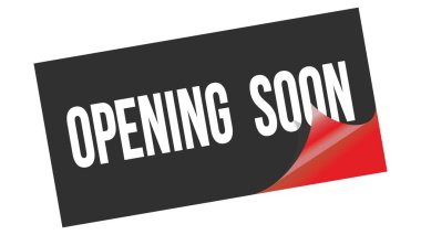 Siyah kırmızı etiket damgası üzerine yazılan yakında açılacak metin.