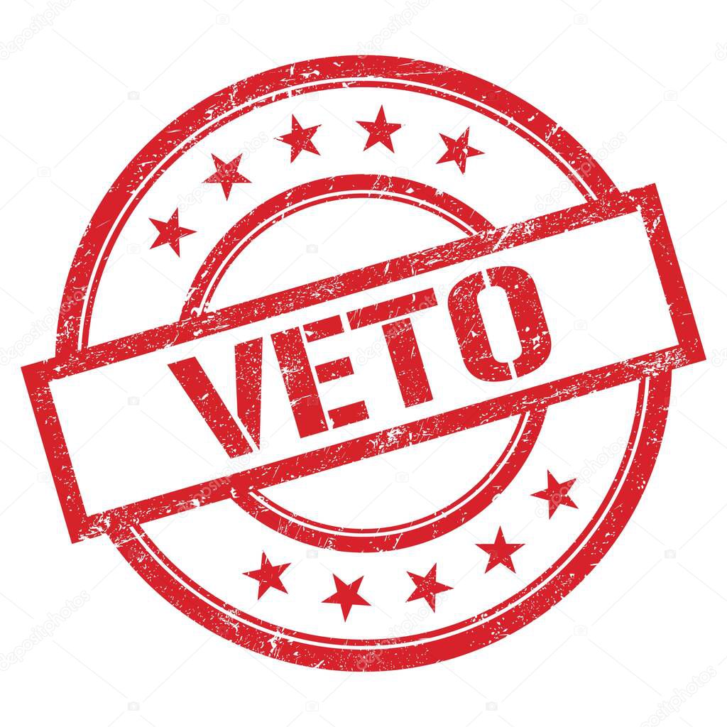 VETO text written on red round vintage rubber stamp.
