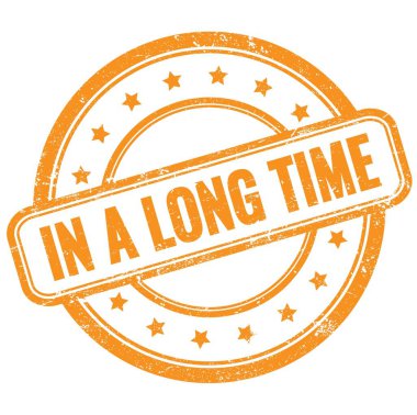 Uzun bir Time metninde turuncu, eski, pasaklı, yuvarlak, lastik damga üzerine.