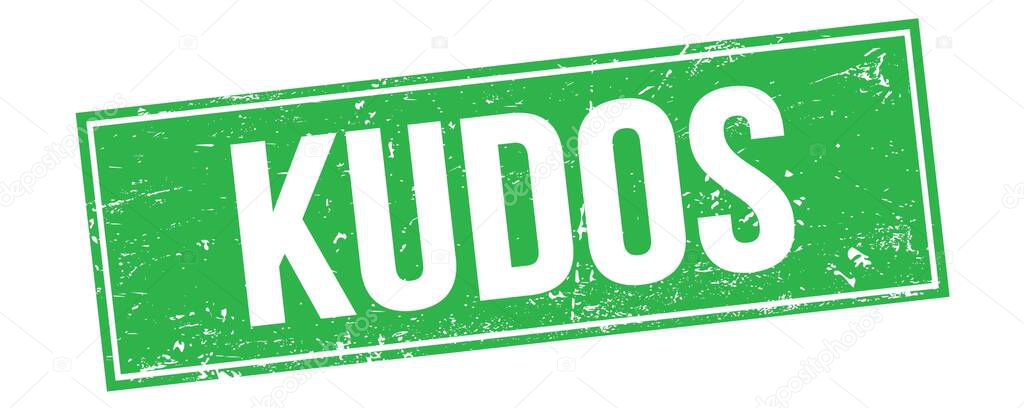 KUDOS text on green grungy rectangle stamp sign.