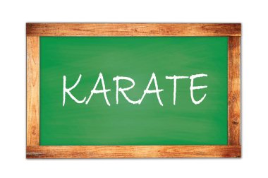 Yeşil ahşap çerçeve okul tahtasına yazılmış Karate metni.
