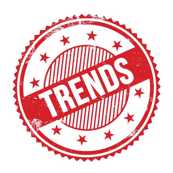 TRENDS text written on red grungy zig zag borders round stamp.