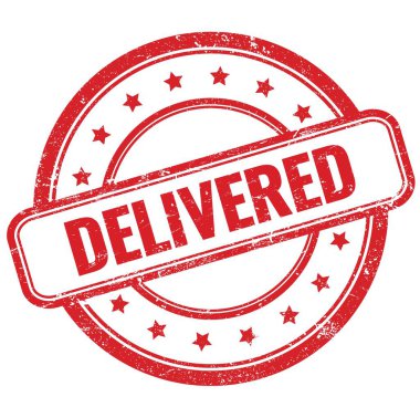 Kırmızı, eski, pasaklı, yuvarlak lastik damga üzerine DELIVERED metin.