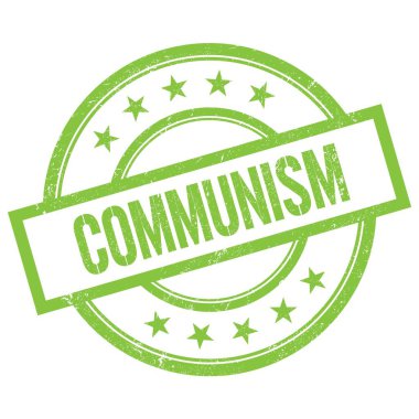 Yeşil yuvarlak vintage kauçuk damgalı COMUNISM metni.