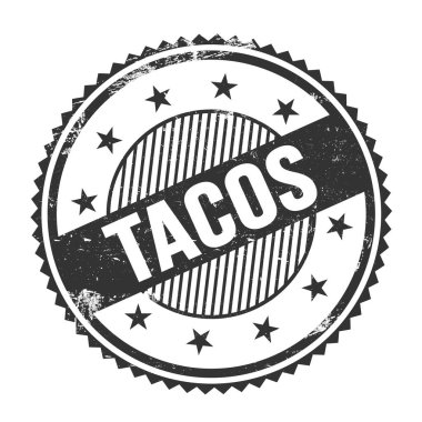 Siyah grungy zig zag kenarları üzerine yazılmış TACOS metni pul yuvarlak.