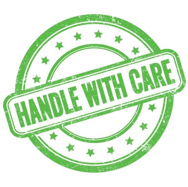 Yeşil, eski, pasaklı, yuvarlak lastik damga üzerine dikkat metni olan el bilgisayarı..