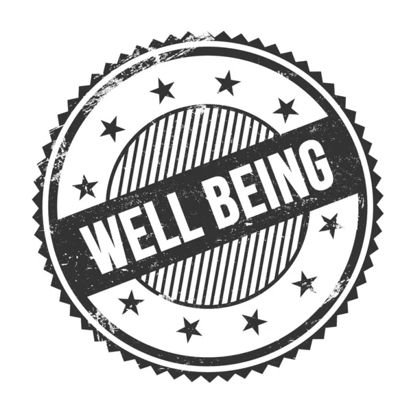 WELL BEING text written on black grungy zig zag borders round stamp.