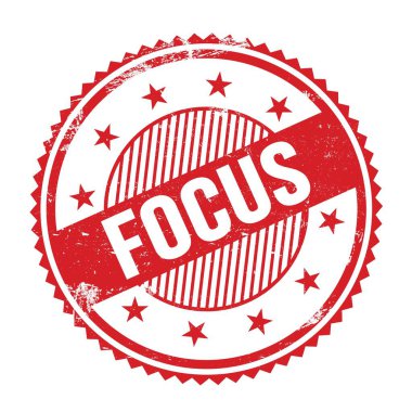 Kırmızı grungy zig zag kenarları üzerine yazılmış FOCUS metni pul yuvarlak.