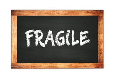 FRAGILE text written on black wooden frame school blackboard.