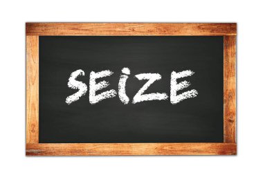 SEIZE text written on black wooden frame school blackboard.