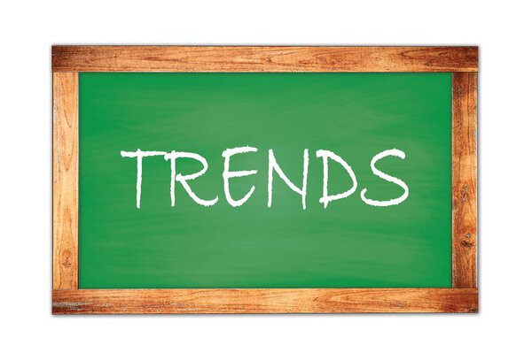 TRENDS text written on green wooden frame school blackboard.