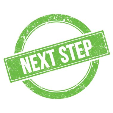 NEXT STEP text on green grungy round vintage stamp.