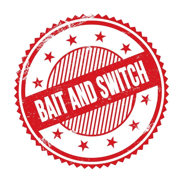 Kırmızı grungy zig zag kenarlarında yazılmış BAIT ve Switch metni yuvarlak pul.