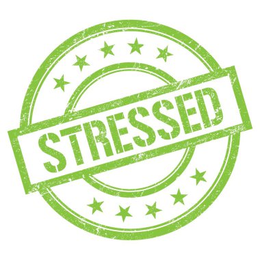 Yeşil yuvarlak vintage kauçuk damgalı STRESED metni.