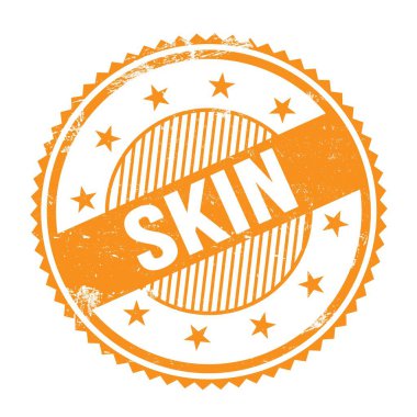 Turuncu grungy zig zag kenarları üzerine yazılmış SKIN metin yuvarlak pul.