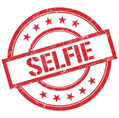 SELFIE metni kırmızı yuvarlak plastik damga üzerine yazılmış.