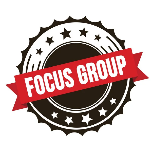 Kırmızı kahverengi kurdele damgalı FOCUS GROUP metni.