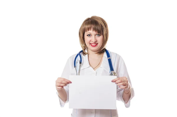 The doctor keeps a white leaf in a white dressing gown — Stock Photo, Image