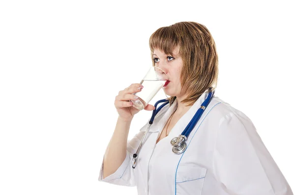 The doctor drinks water from a glass Stock Picture