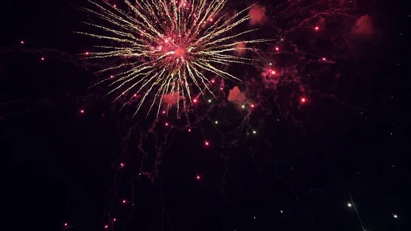 Shining fireworks with bokeh lights in the night sky. glowing fireworks show. New years eve fireworks celebration. multico lored fireworks in night sky. beautiful colored night explosions in black — Stock Photo, Image