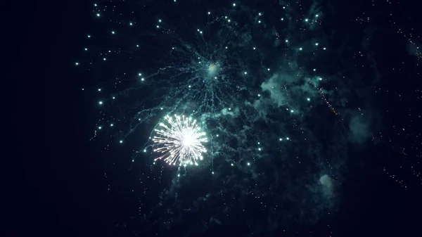 Colored night explosions in black sky. beautiful multi colored fireworks in night sky. New years eve fireworks celebration. shining fireworks with bokeh lights in night sky. glowing fireworks show. — Stock Photo, Image