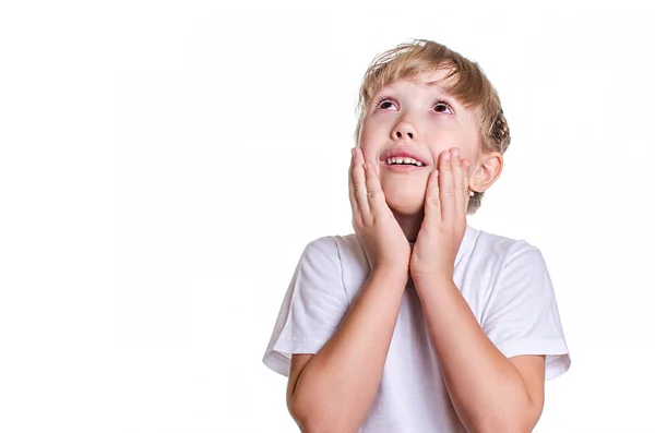 Pigen holder hænder kinder og smiler - Stock-foto