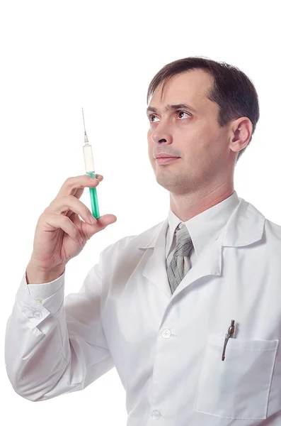 Läkaren håller i handen en spruta med medicin — Stockfoto