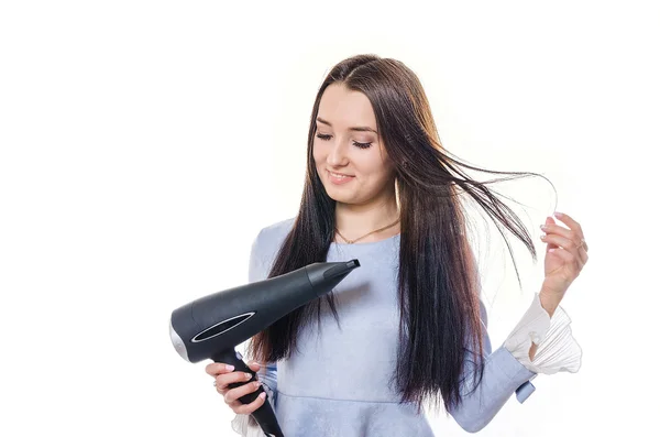 The woman with long hair dries the head — Stock Photo, Image