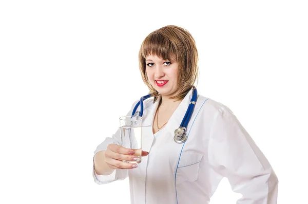 The doctor holds a glass with water in hand and smiles — Stock Photo, Image