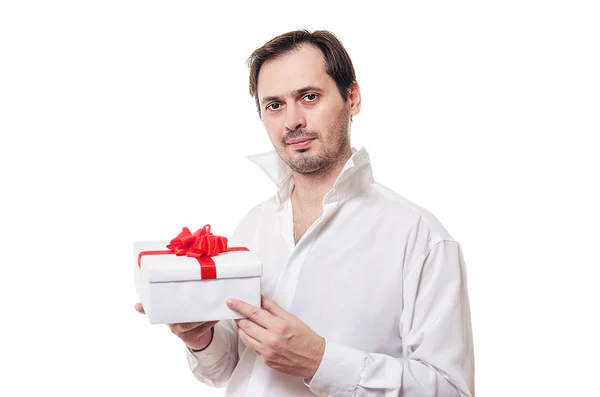 The man holds a beautiful gift in hand — Stock Photo, Image