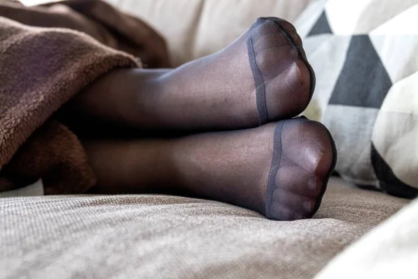 Closeup Portrait Feet Black Pantyhose Person Lying Couch Brown Cosy — Stock Photo, Image