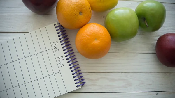 Diet food and diet plan on wooden  background