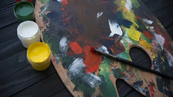 Wooden Art Palette Paints Brushes — Stock Photo, Image