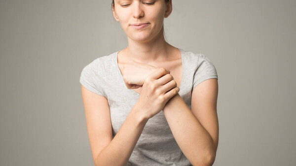 Tired woman feeling neck pain, massaging tense muscles