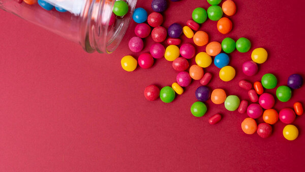 colorful little candies on a colored background