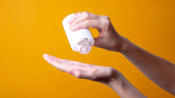 Female Hand Holding Face Body Lotion — Stock Photo, Image